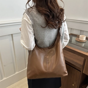 Deep brown leather hobo shoulder bag for women with minimalist tote design for work