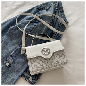 Detail of white leather and gray M-pattern crossbody bag with silver metal ring logo