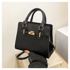 Detailed macro view of black PU leather texture with gold buckle and secure lock closure