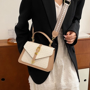 Elegant beige woven texture handbag with tan leather handles and wide geometric shoulder strap