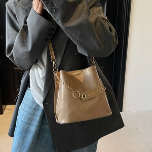 Latte brown leather bucket bag with gold chain strap for women casual fashion wear