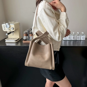 Minimalist earth tone lychee grain leather tote bag with FASHION embossed detail
