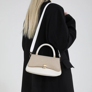 Chic two-tone handbag with woven texture and gold metal handle for elegant office style