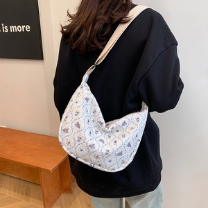 Minimalist beige casual tote bag with blue bear prints and adjustable shoulder strap