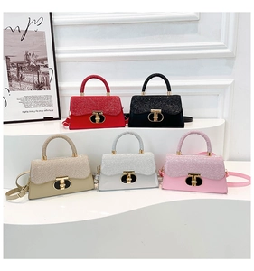 Five small square handbags with shimmer flap and gold T-lock shown in multiple colors