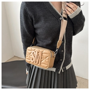 Detail of khaki crossbody bag with 3D SM logo, diamond quilting and wide nylon strap