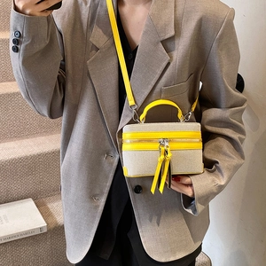 Stylish box handbag in beige canvas and yellow leather with thin shoulder strap