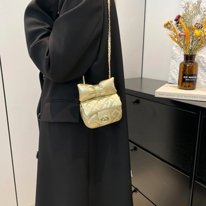 Mini gold bow quilted chain crossbody bag for women with elegant metallic finish