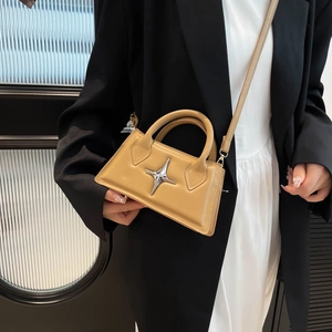 Minimalist ginger yellow leather crossbody bag with silver star buckle for women