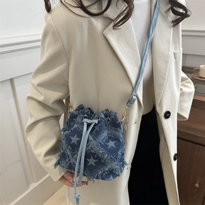 Retro denim bucket bag with white star print and fringed edges for women fashion