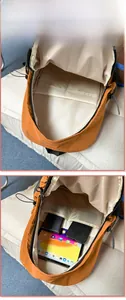 Internal view of the large capacity orange backpack showing compartments and storage