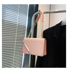 Pink PU leather crossbody bag with woven texture flap and silver metal trim detail