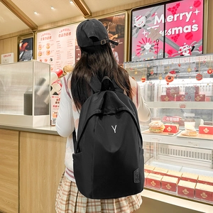 Minimalist black large capacity backpack for school and commuting with adjustable straps
