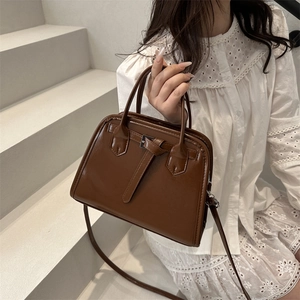 Vintage dark brown leather tote bag with silver buckle and detachable shoulder strap