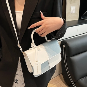 Chic blue and white color-block PU leather handbag with top handle and shoulder strap