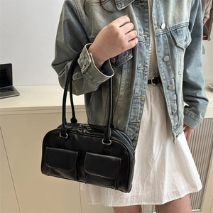 Minimalist black faux leather shoulder bag with dual magnetic pockets and silver hardware