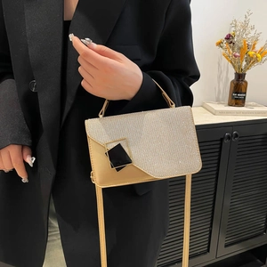 Elegant beige vintage handbag with silver glitter flap and stylish black buckle detail