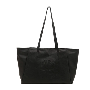 Large black faux leather tote bag with embossed round logo and dual shoulder straps