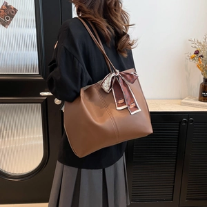 Brown leather tote bag with silk ribbon decoration and large capacity for commuting