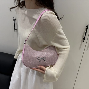 Pink rhinestone hobo bag with silver metal bow and matching leather shoulder strap