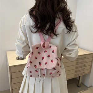 Pink corduroy mini backpack with strawberry pattern for women in a vintage style