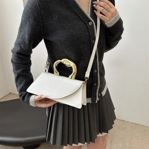 Minimalist white leather crossbody bag featuring an irregular gold metal handle for women