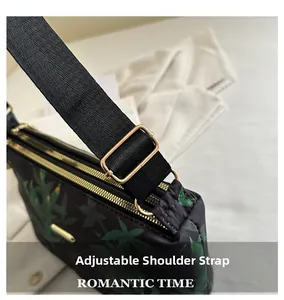 Detail of adjustable black nylon strap with high-quality gold metal buckle on tote bag