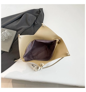 Top view of large beige tote bag showing spacious interior and secure zipper pocket