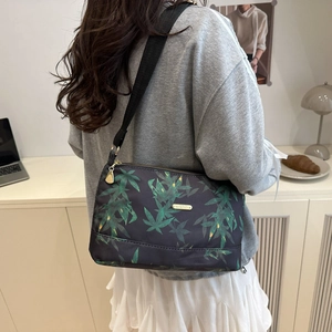Casual large tote bag with green leaf print and adjustable crossbody shoulder strap