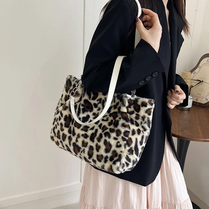 Chic leopard print plush tote bag with white leather straps and silver chain link