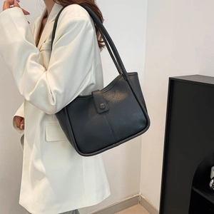 Minimalist black tote bag in high-quality faux leather for casual daily commute wear
