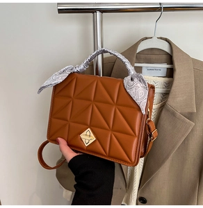 Brown quilted PU leather handbag featuring a vintage paisley silk scarf handle detail