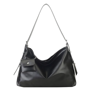 Minimalist black leather tote bag with a small matching purse and silver hardware