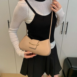 Minimalist beige moon-shaped shoulder bag with metallic hook clasp for women