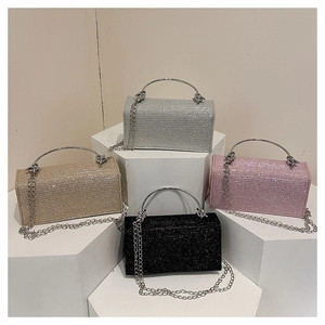 Showcase of four sparkling evening bags with metal ring handles and detachable chain straps