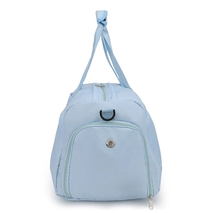 Detail view of water-resistant light blue nylon travel bag with top handles and side D-ring