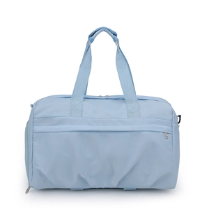 Detailed front view of the light blue large capacity travel and fitness bag with reinforced handles