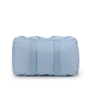 Detail of light blue waterproof nylon travel bag featuring reinforced handles and metal zipper