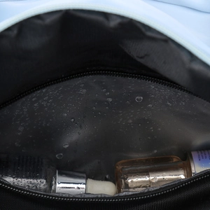 Detail of waterproof inner layer with water droplets and zipper for large tote bag