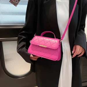 Chic magenta quilted handbag with gold hardware for women's crossbody and top-handle use