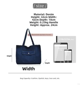 Detail of blue denim tote bag with size specs and large capacity capacity demonstration