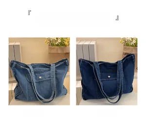 Close-up of light and dark blue denim tote bags with functional front pocket detail