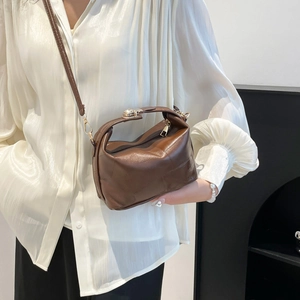 Classic dark brown leather handbag with gold buckle handle and adjustable strap for women