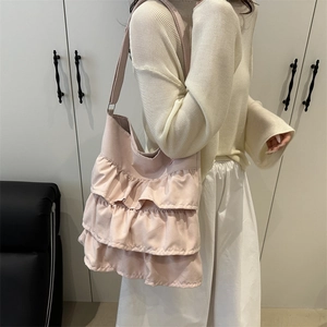 Pink ruffle pleated tote bag for women showing three-layer tiered design and shoulder fit