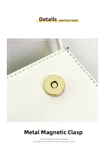 Detail der weißen Ledertasche mit goldener Magnetschnalle und schwarzen Kontrastnähten
