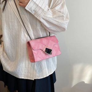 Pink quilted crossbody bag with gold-trimmed metal lock and elegant chain strap for women