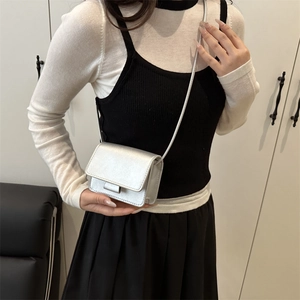 Chic silver mini square crossbody bag for women with minimalist flap design and thin strap