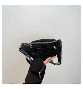 Detail of black rhinestone waist bag with wide striped strap and mini coin pouch