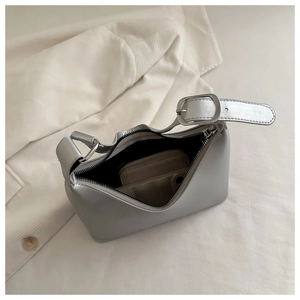 Detail view of silver hobo underarm bag interior showing storage space for daily items