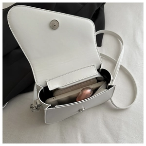 Top view of white saddle bag interior showing space for phone and essentials
